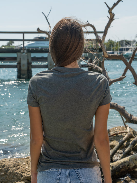 Woman wearing a t-shirt by a waterfront