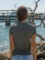 Woman wearing a t-shirt by a waterfront