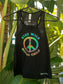 Black tank top with colorful peace sign and text 'Stay Wild, Explore Child' on a hanger against a leafy green background.